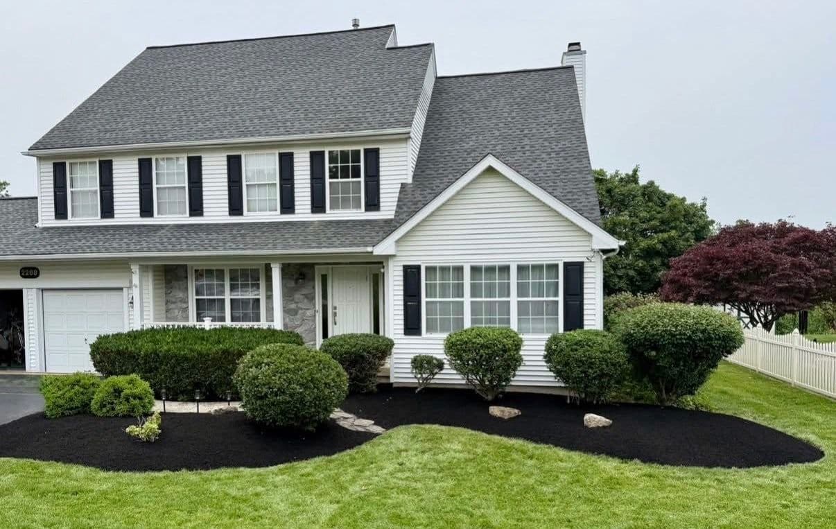 Fresh Mulch and Trimmed Beds That Make a Yard Stand Out image